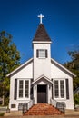 Little white country church with blue skies. Royalty Free Stock Photo