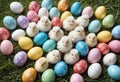 Little white Easter chicks nestled among colorful painted Easter eggs Royalty Free Stock Photo