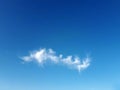 Little white fluffy cloud on clear blue sky Royalty Free Stock Photo