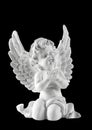 Little white guardian angel isolated on black background Royalty Free Stock Photo