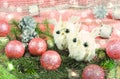 Little white owl sitting on a Christmas tree near Christmas toys Royalty Free Stock Photo