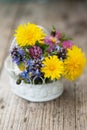 Little wild flower bouquet on wooden background Royalty Free Stock Photo