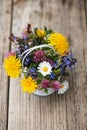 Little wild flower bouquet on wooden background Royalty Free Stock Photo