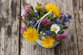 Little wild flower bouquet on wooden background Royalty Free Stock Photo