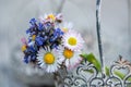 Little wild flower bouquet in a little basket Royalty Free Stock Photo