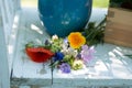 Little wild flower bouquet on a garden bench Royalty Free Stock Photo