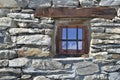 Little window on stoned facade