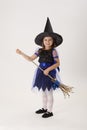 Little witch with a broom