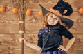 Little witch with a broomstick