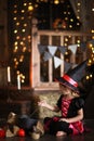 Little witch in costum and hats conjure pot, childhood hallowee Royalty Free Stock Photo