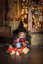 Little witch in costum and hats conjure pot, childhood hallowee Royalty Free Stock Photo