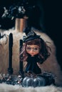 Little witch. Happy Halloween. Custom Blythe doll dressed up as a witch apprentice. Pumpkins and potions are surrounding her. Royalty Free Stock Photo