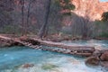 Little wooden bridge over mountain river Royalty Free Stock Photo