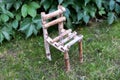 Little wooden chair on green grass Royalty Free Stock Photo