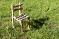 Little wooden chair on green grass Royalty Free Stock Photo