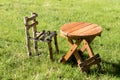 Little wooden chair and small round table on green grass Royalty Free Stock Photo