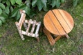 Little wooden chair and small round table on green grass Royalty Free Stock Photo