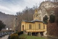 Little wooden chapel built on river