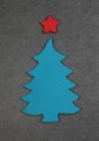 Little wooden christmas tree on the gray background. Flat lay. Copy space. Top view. Royalty Free Stock Photo