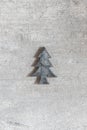 Little wooden Christmas tree ornament on a wooden background. Wi Royalty Free Stock Photo