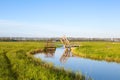 Little wooden open bridge over Dutch canal