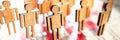 Little wooden toy people figures stand in row Royalty Free Stock Photo