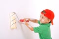 Little worker with paintroller Royalty Free Stock Photo