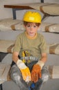 Little workman with security helmet Royalty Free Stock Photo