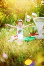 Little 3 years old girl in hat play in watermelon seller with big old fashioned white scales. Emotional kid laugh with flying