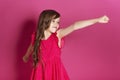 Little 8 years old girl make some emotional gesture with her han Royalty Free Stock Photo