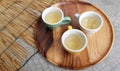 Little yellow cup of white tea. Royalty Free Stock Photo