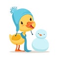 Little yellow duck chick wearing blue knitted hat playing with snowman, cute emoji character vector Illustration Royalty Free Stock Photo