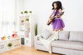 Little girl playing crazily on the sofa. Royalty Free Stock Photo