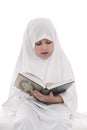 Little Young Muslim Girl Reading Quran