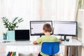 Little young school boy working at home with a laptop and class notes studying in a virtual class. Distance education and learning Royalty Free Stock Photo