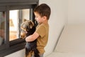 Child with baby dog. Kid with puppy. Royalty Free Stock Photo