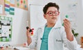 The littlest of things matter most in science. an adorable young school boy learning about molecules in science class at Royalty Free Stock Photo