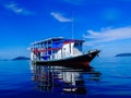 Live aboard dive boat awaiting divers to return, Raja Ampat, Indonesia