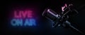 Live on air. radio podcast broadcasting studio microphone with neon lights sign. banner