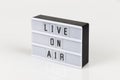 live on air sign on white