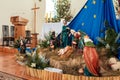 Live Christmas nativity scene reenacted in a medieval barn - the baby is a doll Royalty Free Stock Photo