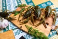 Live crayfish on a wooden board