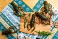 Live crayfish on a wooden board