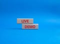 Live Demo symbol. Concept word Live Demo on wooden blocks. Beautiful blue background. Business and Live Demo concept. Copy space Royalty Free Stock Photo