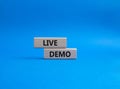 Live Demo symbol. Concept word Live Demo on wooden blocks. Beautiful blue background. Business and Live Demo concept. Copy space Royalty Free Stock Photo
