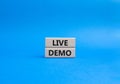 Live Demo symbol. Concept word Live Demo on wooden blocks. Beautiful blue background. Business and Live Demo concept. Copy space Royalty Free Stock Photo