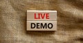 Live demo symbol. Concept words `live demo` on wooden blocks on a beautiful canvas background. Copy space. Business and live dem Royalty Free Stock Photo