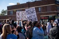 Live demonstrators and protestors holding signs in the streets at the minneapolis riots for george floyd