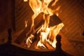 Live fire. Logs burn beautifully in fireplace Royalty Free Stock Photo