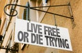 Live Free or Die Trying sign in a conceptual image Royalty Free Stock Photo